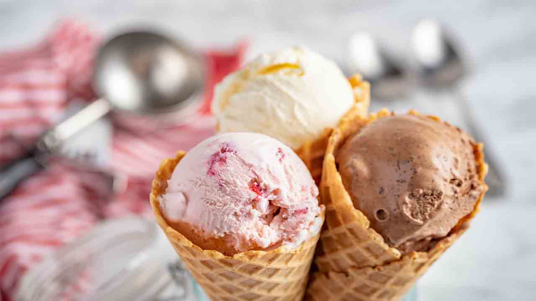 strawberry, vanilla, chocolate ice cream woth waffle cone on marble stone backgrounds