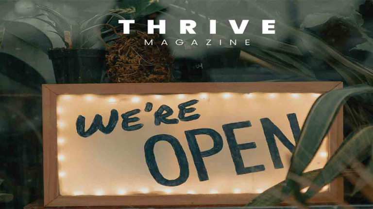 we're open sign in a window