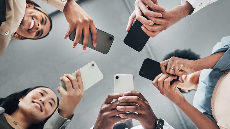 People holding their smartphones.