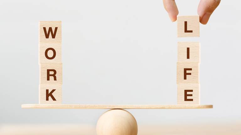 Work life balance concept. Wooden cube block with word WORK and LIFE on seesaw
