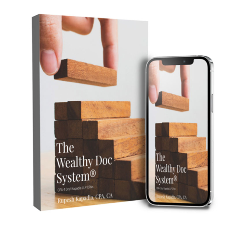 A phone and photo showing wooden blocks being stacked by a hand.