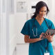 A healthcare worker looking at a tablet