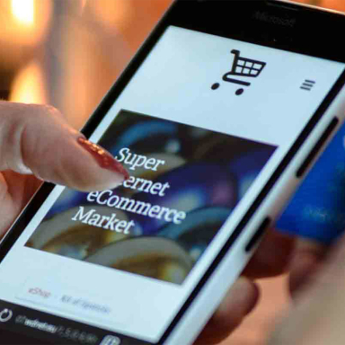 A cellphone with an image of an eCommerce site.