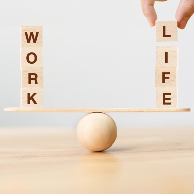 Work life balance concept. Wooden cube block with word WORK and LIFE on seesaw