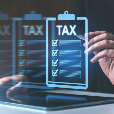 A person using an ipad to check off items on their tax to-do list.