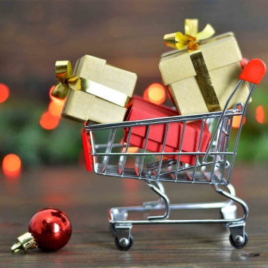 shopping cart with holiday gifts