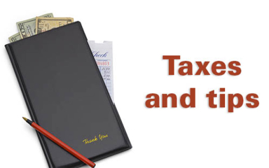 A receipt book with money stick out of the top an a pen resting on it.