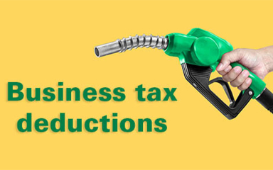 A hand holding a gas pump handle.