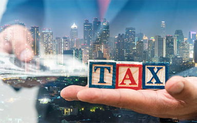 Hands holding wooden blocks and money with a city skyline in the background.