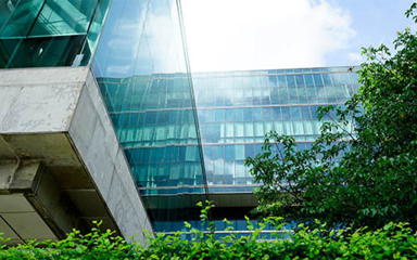 An office building with trees outside.