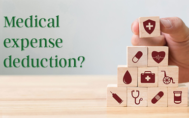 Hand stacking wooden blocks.