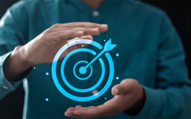 A person with a visual of a target and an arrow in the middle between their hands.