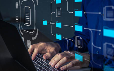 Hands resting on a laptop.