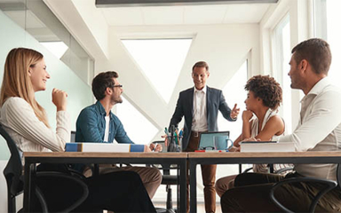 A group of professionals in a meeting room.