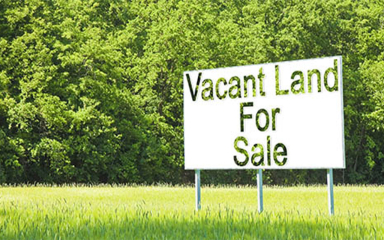 A Vancant Land For Sale sign