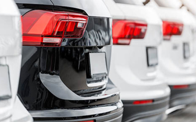 The backs of multiple SUV's.