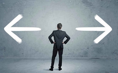 A guy in a suit staring at a wall with an arrow pointing left and right.