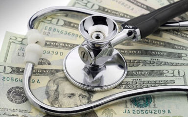 A stethoscope on 20 dollar bills.