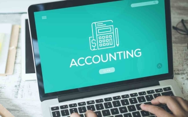 accounting text on laptop screen