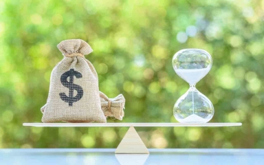 scales balancing money & time