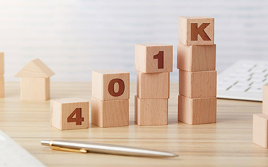 Wooden blocks stacked to spell out 401k.