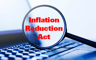 Magnifying glass and laptop keyboard.