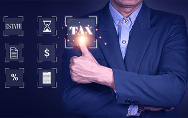 Man in suit with a thumbs up near the word tax.