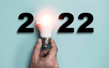 A hand holding a lightbulb.