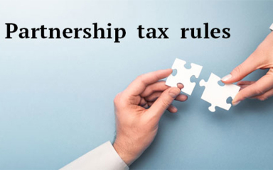 Two hands putting together two puzzle pieces.