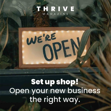 we're open sign in a window