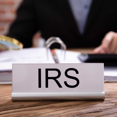 IRS labeled on a nameplate on a desk