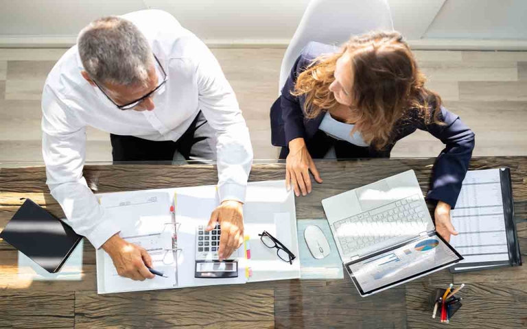 man and woman at a desk