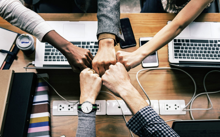 People fist bumping.