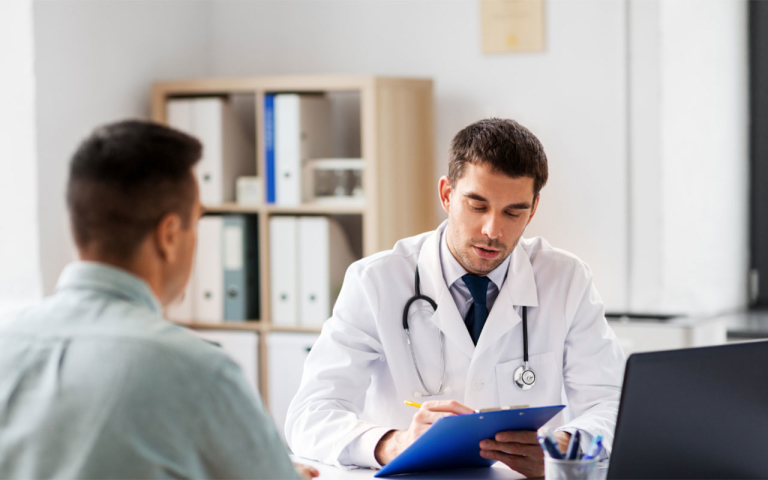 A doctor and a patient in an office.