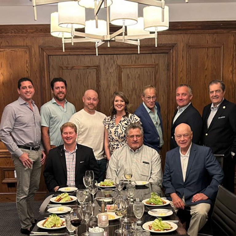 Group of business professionals at a restaurant.