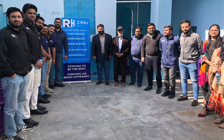 A group of employees posing for a photo.