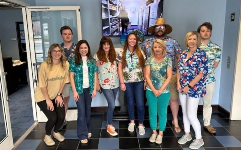 Professionals dressed in tropical clothing.