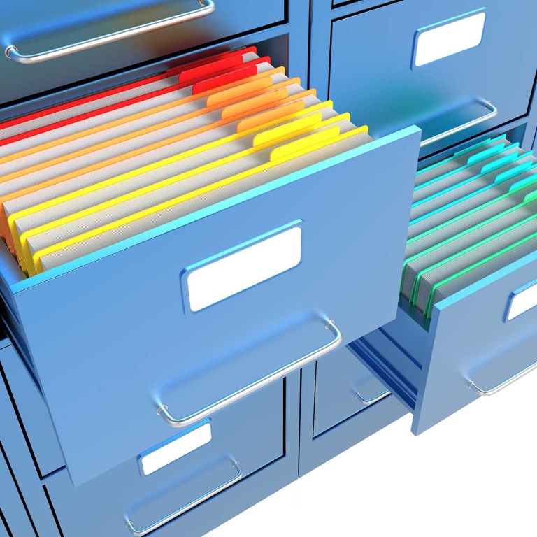 File cabinet drawer open with bright colored files inside.