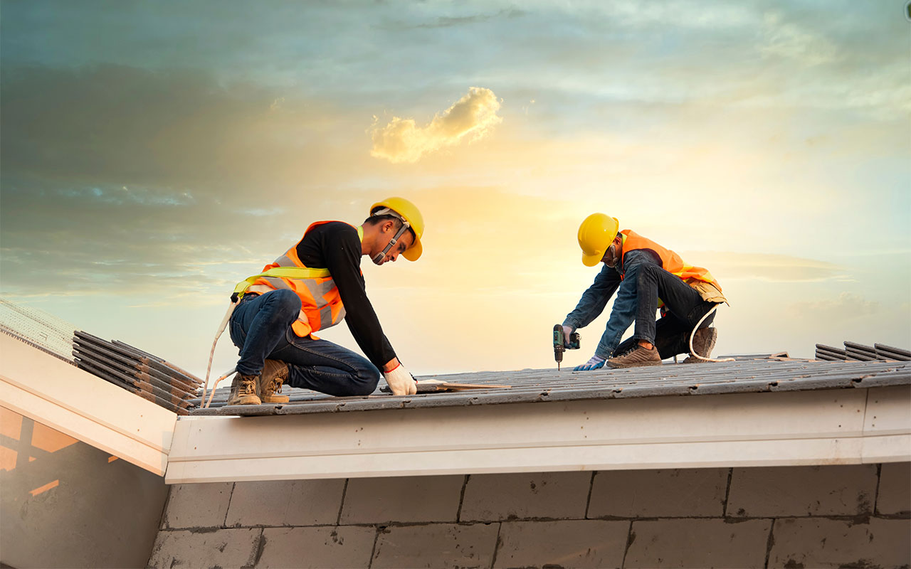 Roofers fixing a roof
