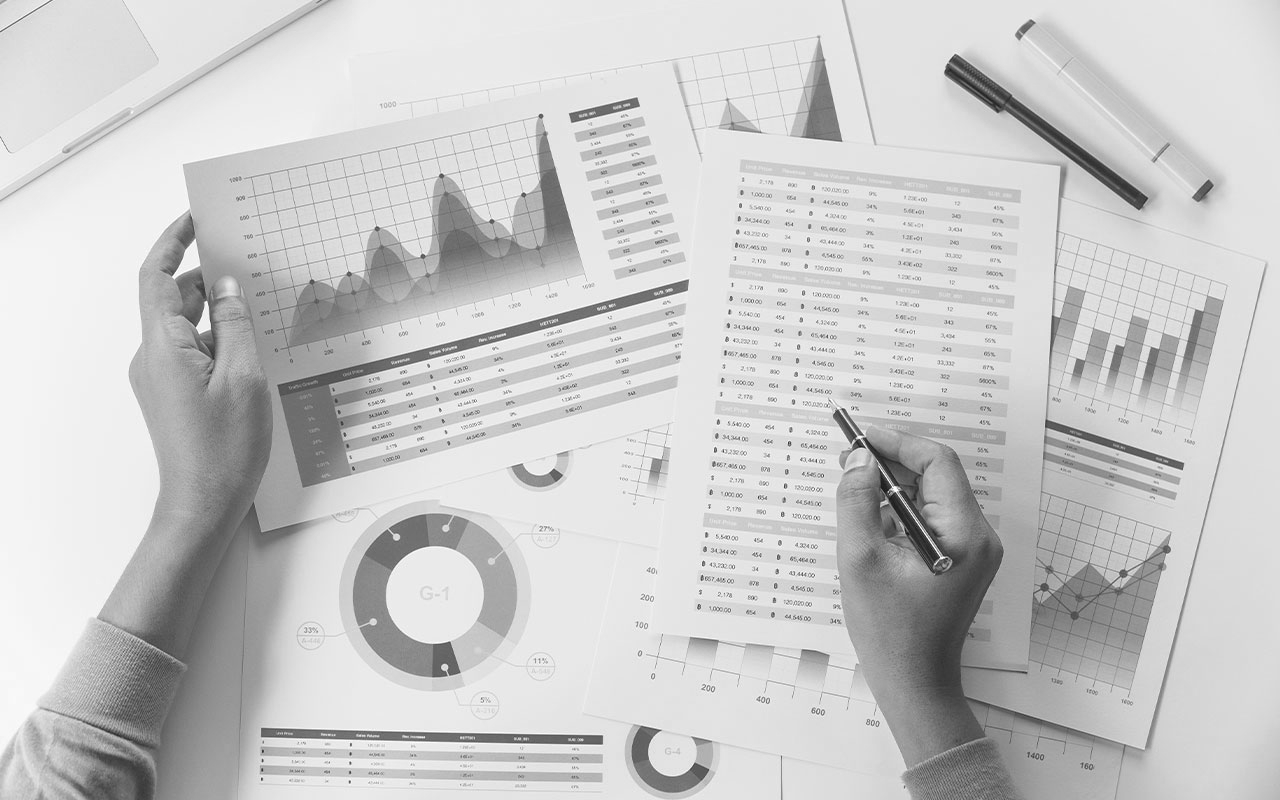 Papers with graphs and numbers.