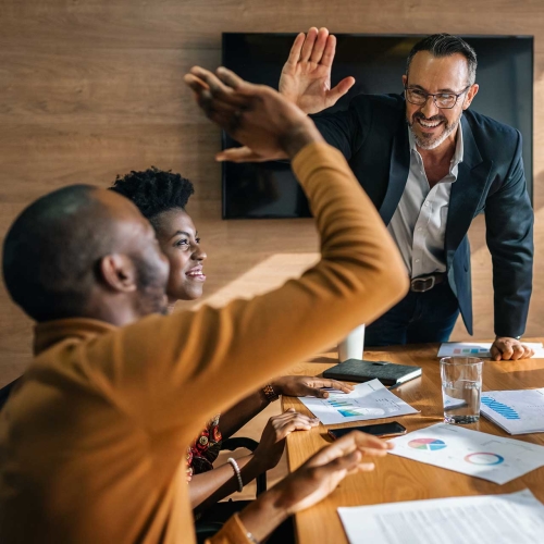 Professionals high-fiving.