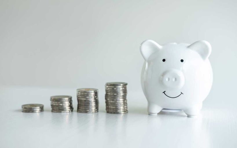 Image of piggy bank and stacking pile coins to planning growing saving strategy for future plan fund of travel, education, investment and retirement