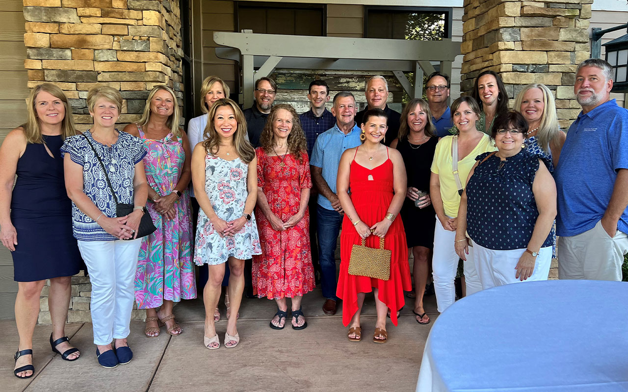 Group photo outside a resort.