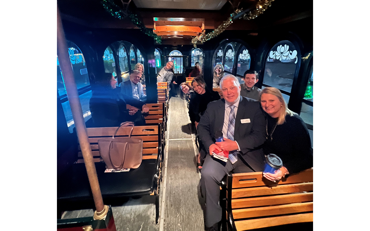 Business professionals on a trolley.