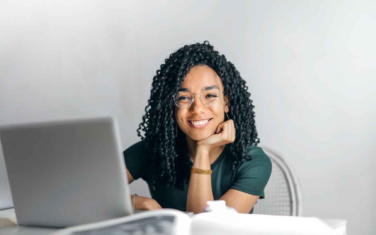 smiling woman with laptop