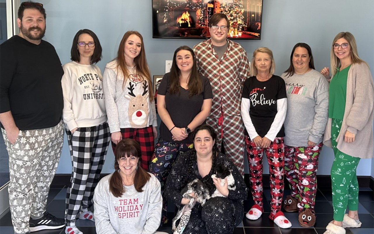 Business professionals wearing Christmas items.