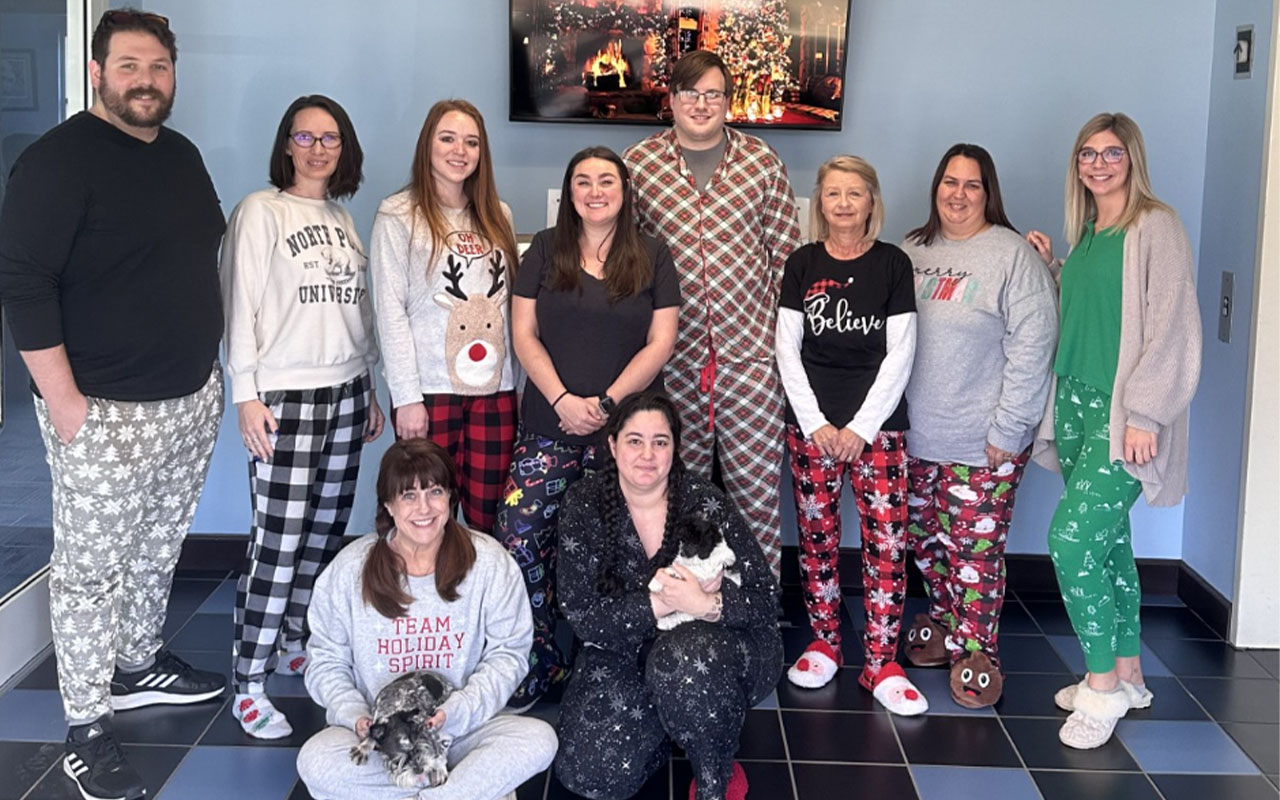 Business professionals wearing Christmas items.