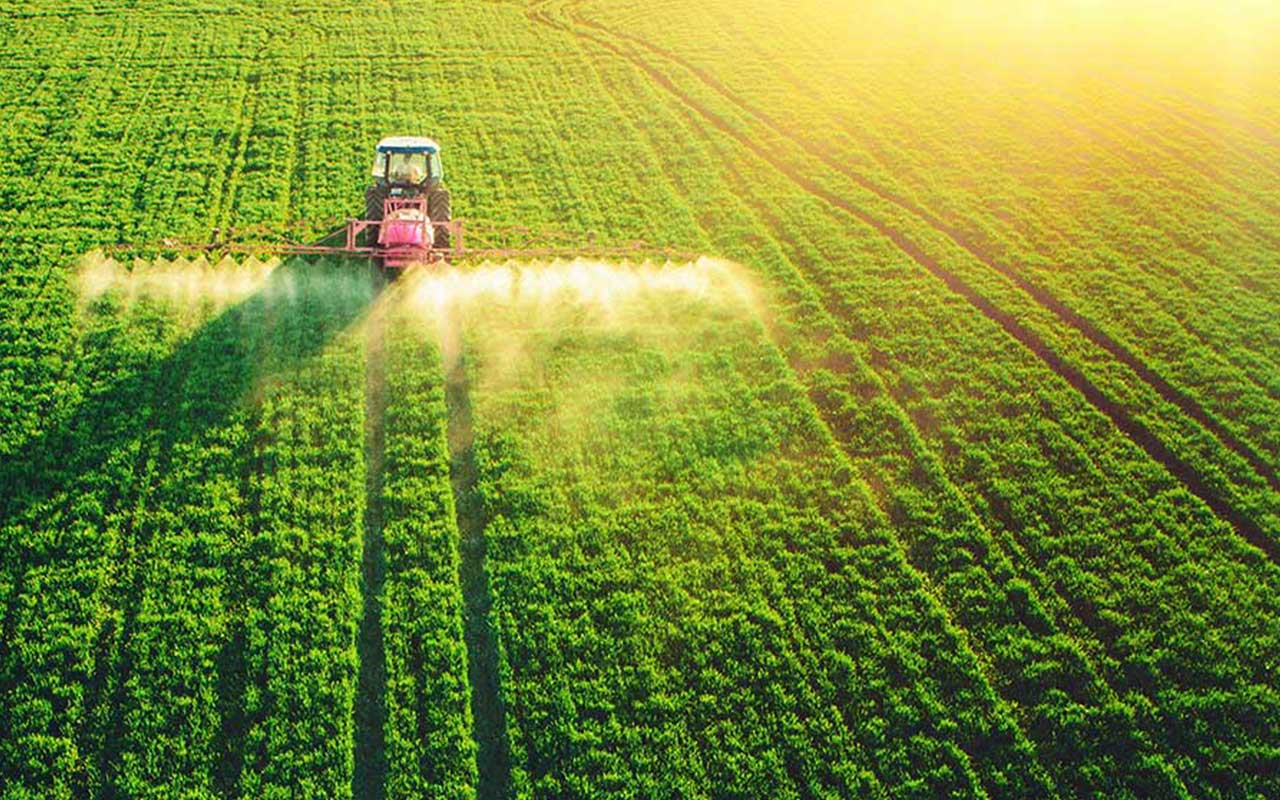 A photo of a tractor on agricultural land