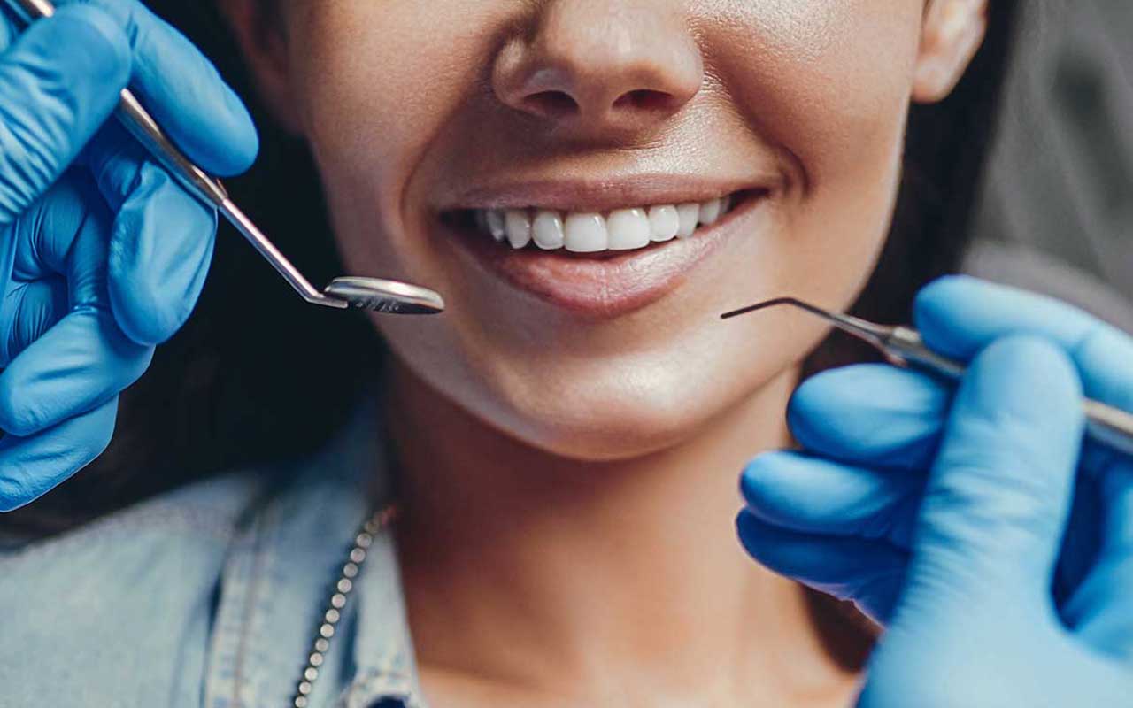 A patient smiling at a dentist office