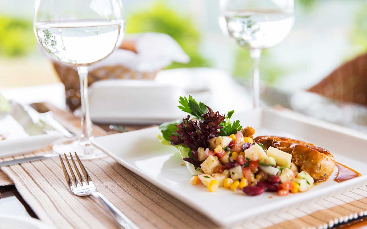 table setting with glasses and food